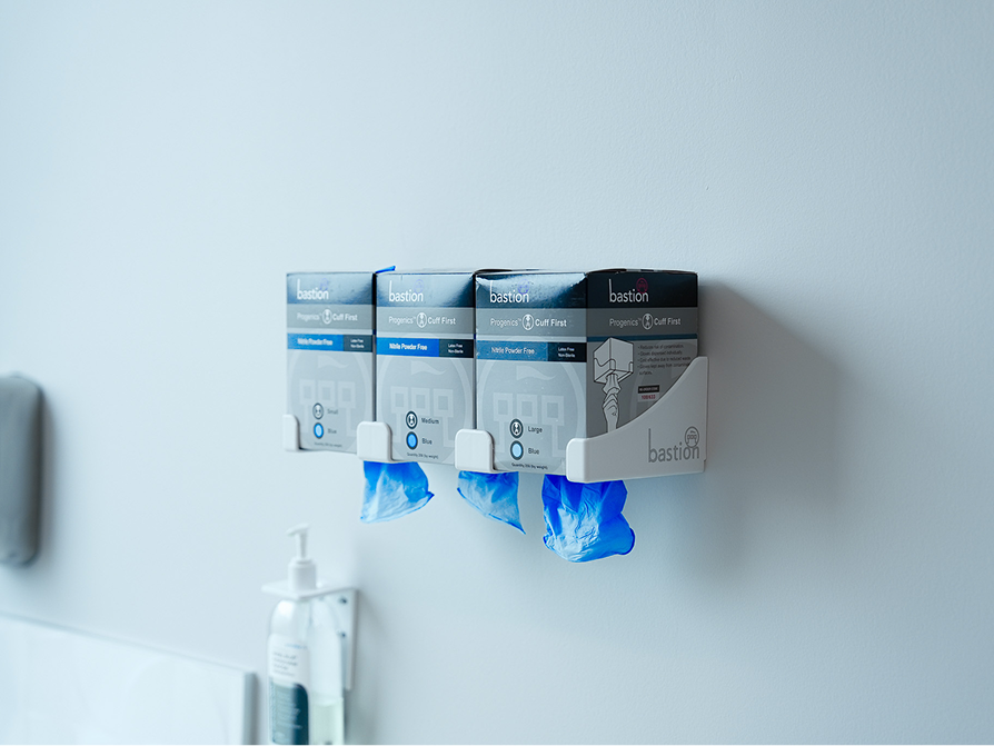 Wall-mounted surgical gloves